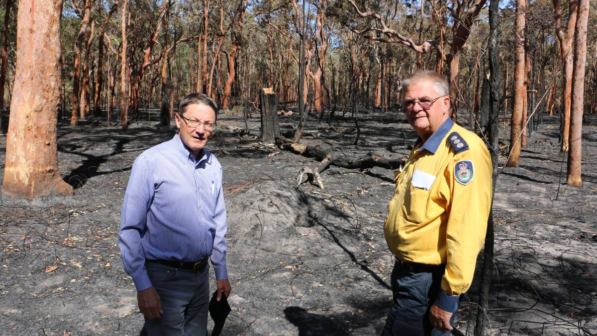ADVICE: Parliamentary Secretary for the Hunter Scot MacDonald MLC and NSW RFS Lower Hunter group officer Neale Mutton at Campvale off Richardson Road.