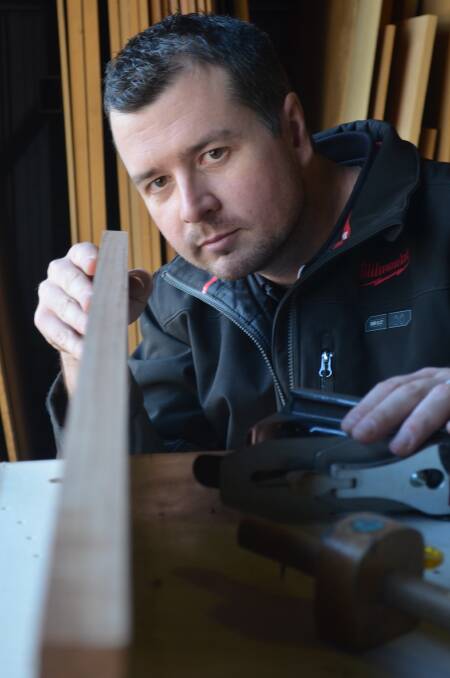EYE FOR DETAIL: Dylan Walsh leads a team of six in the Bessant Custom Furniture workshop. Picture: Sam Norris