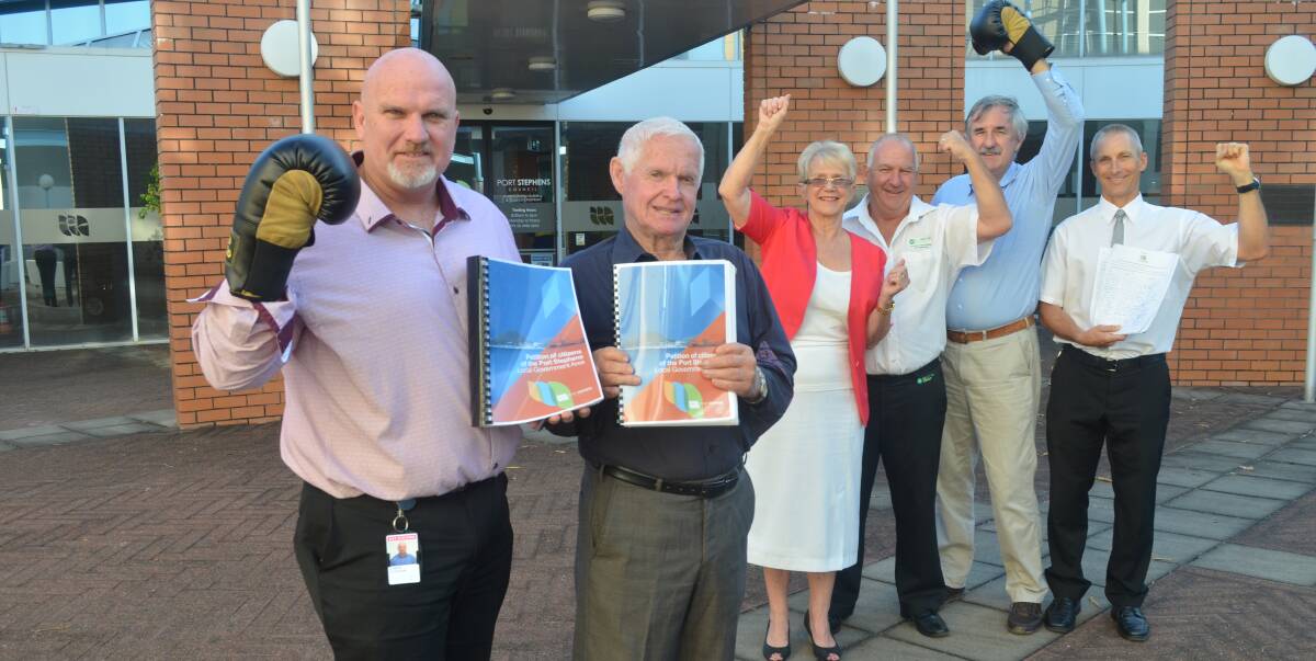 PETITION: Port Stephens Council has got its 10,000 signatures. Pictured are Deputy Mayor Chris Doohan and Mayor Bruce MacKenzie, with councillors  Sally Dover, Paul Le Mottee, Steve Tucker and general manager Wayne Wallis.