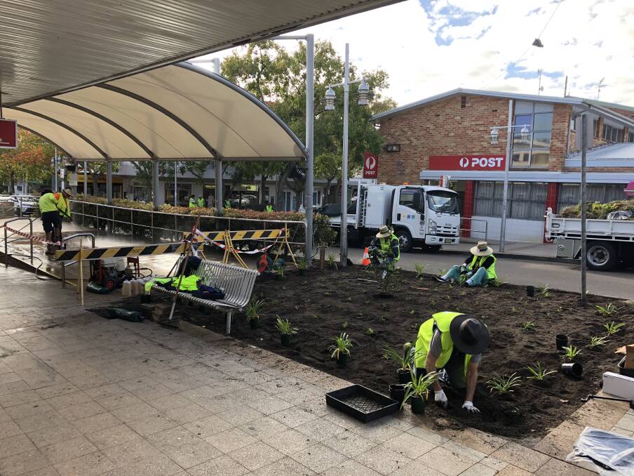 Volunteers and council staff applied some elbow grease to the Nelson Bay town centre