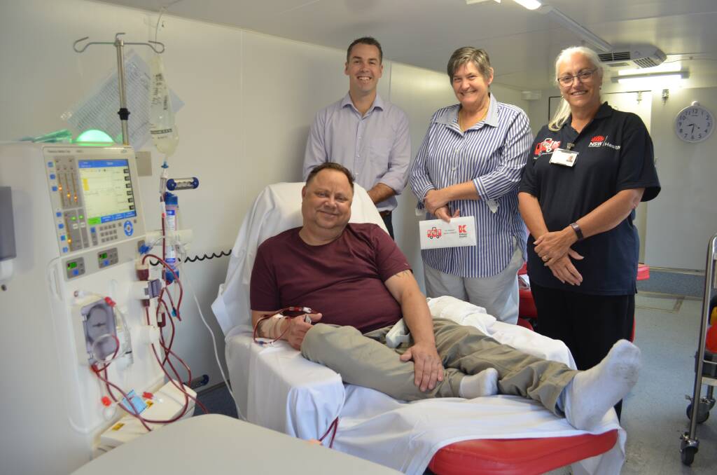ALL ABOARD: Joel Williams of Concord undergoes dialysis. He's pictured with Port Stephens and Dungog mayors Ryan Palmer and Tracy Norman, and registered nurse Anna Flynn. Picture: Sam Norris