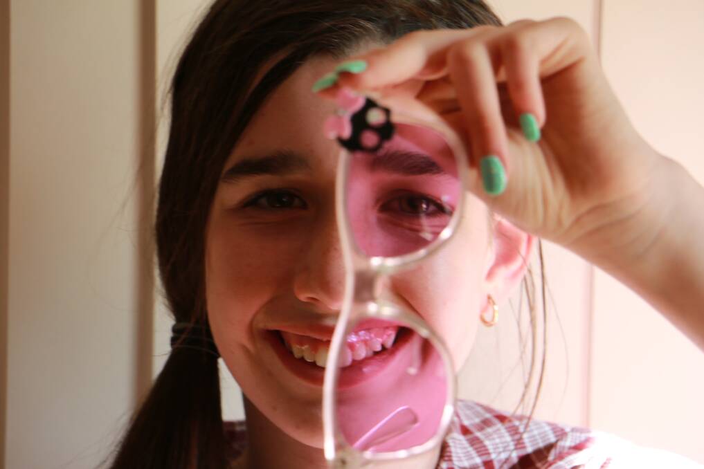 BETTER: Harmonie Baker, 11, finds reading much easier since she's worn Irlen Method lenses. Picture: Sam Norris