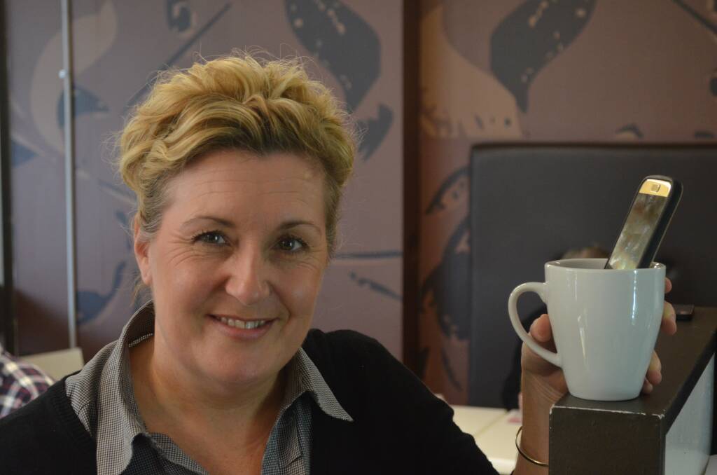 CAUSING A STIR: Cups N Saucers owner Racquel Peapell said her business like many benefits from technology. But she says there's a time and place for smart phones, as an advocate of old fashioned face time. Picture: Sam Norris