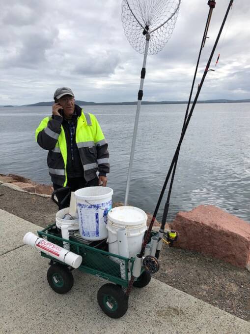  NICE UNIT: Shoal Bay champion Jim Gourlas with his super trolley carrying his fishing essentials.