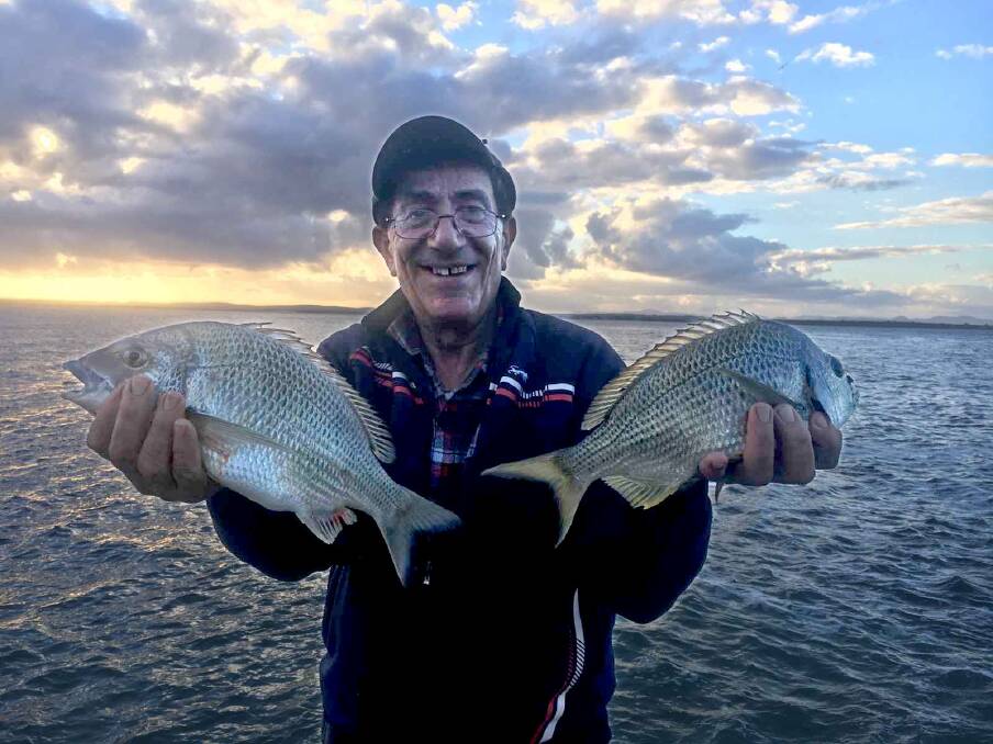 A HANDFUL: Bream champ Jimmy Gourlas with a couple of breakwall beauties.