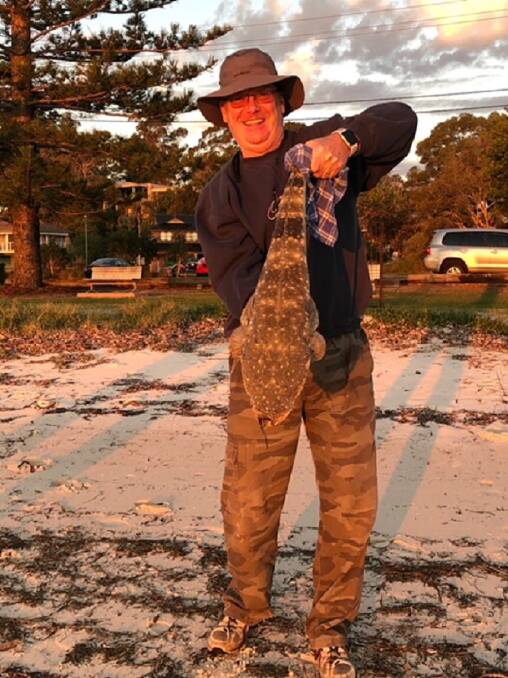 HAPPY INDEED: Richard Crake, of Corlette, with his cracking 75 centimetre flathead.