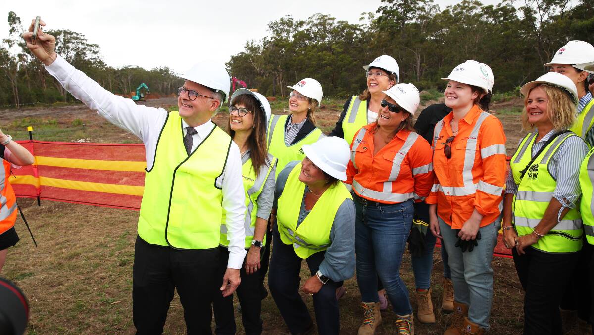 Anthony Albanese takes a group selfie at an M1 extension work site at Heatherbrae on Tuesday. Picture by Peter Lorimer