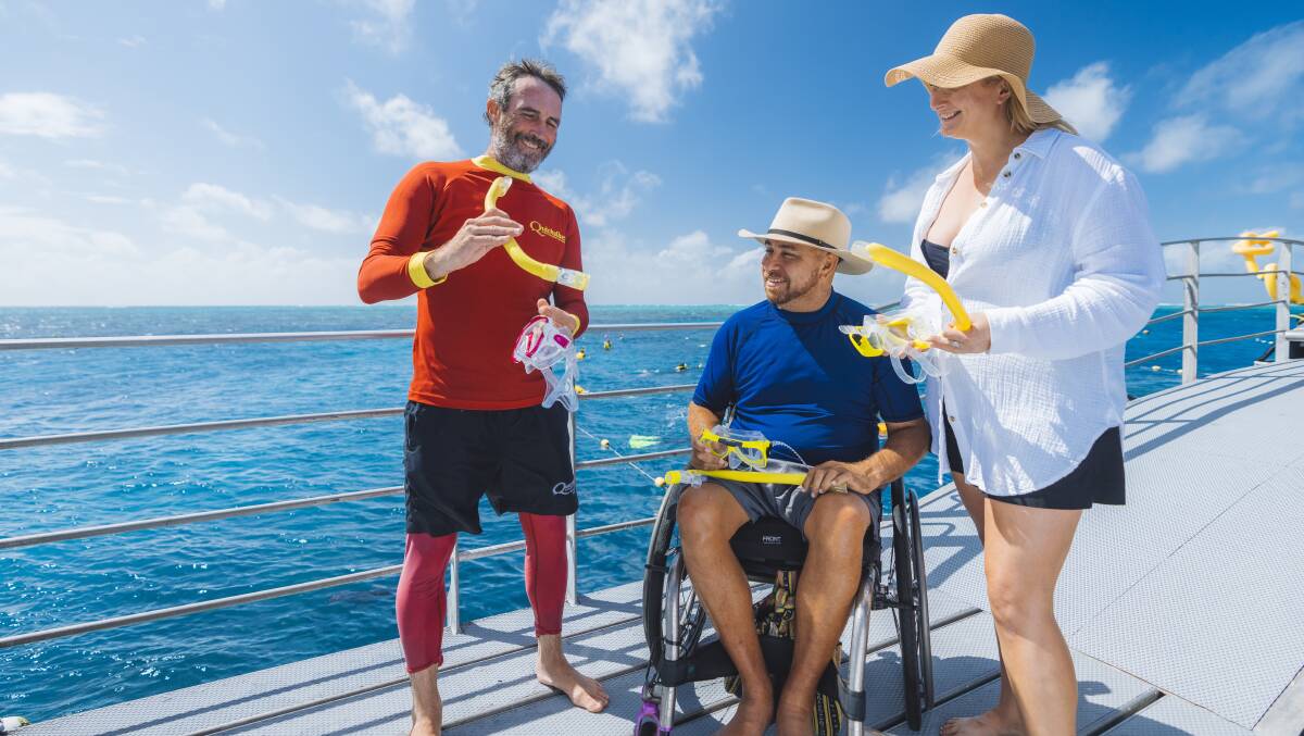 Quicksilver helps people with mobility issues to snorkel and scuba dive at the Great Barrier Reef. Picture Tourism and Events Queensland