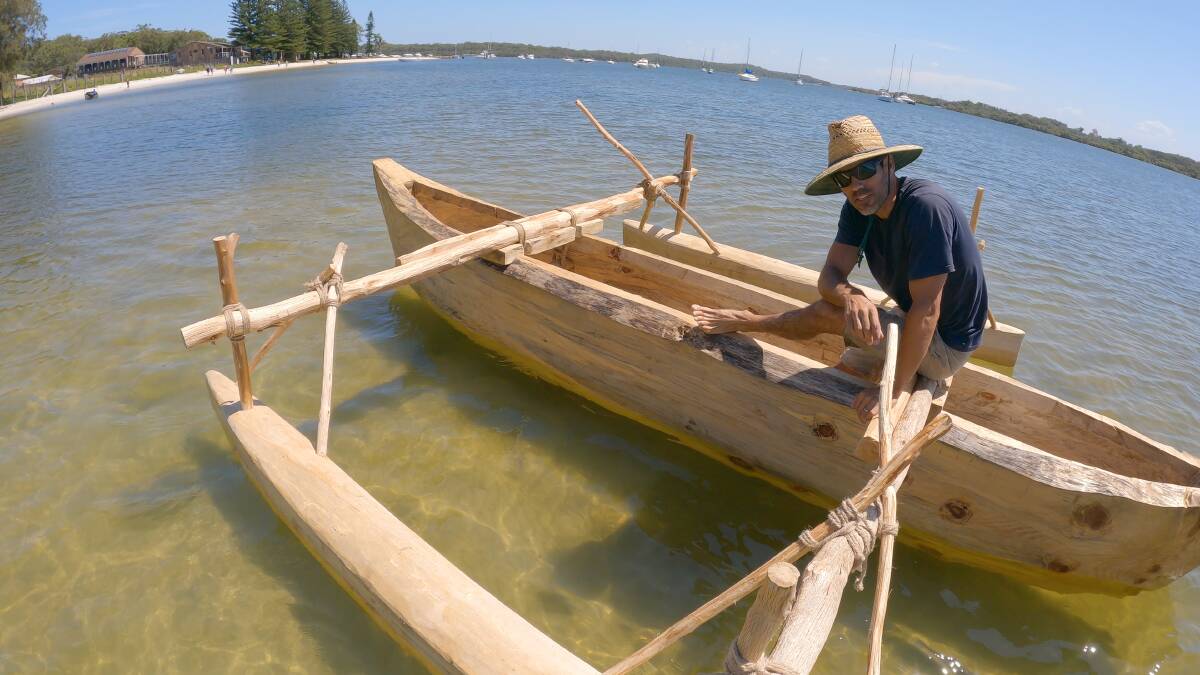 FLOAT TEST: Michael Atkinson testing out his dugout canoe for the first time at Taylors Beach. Picture: Supplied