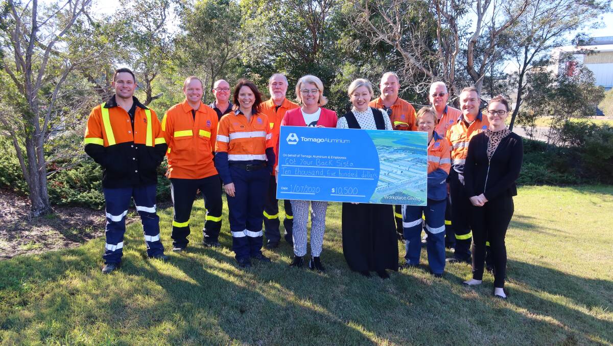 GRATEFUL: Peree Watson and Melissa Histon (founder) from Got Your Back Sista with workers at the Tomago Aluminium cheque presentation. Picture: Supplied