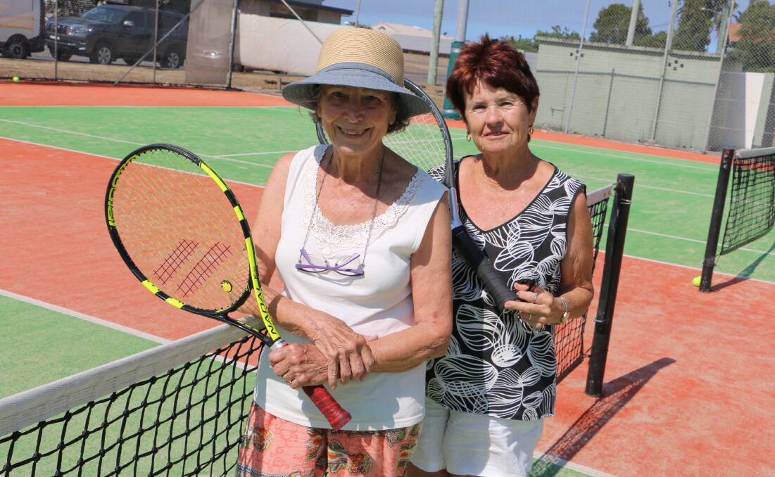 ANYONE FOR TENNIS: Two of Soldiers Point Tennis Club's longest serving members Heather Cowle and Carol Lewis enjoy the active, healthy lifestyle on the court.