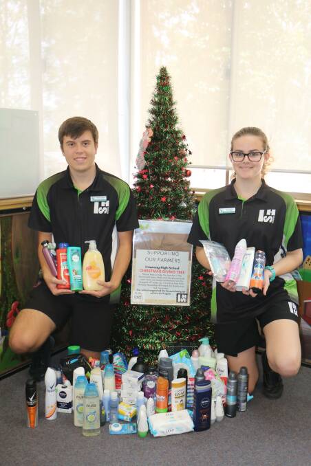Irrawang High School captains Sierra Noffke and Nick Hopper, both 16, display some of the personal items to be distributed to drought-stricken farmers.
