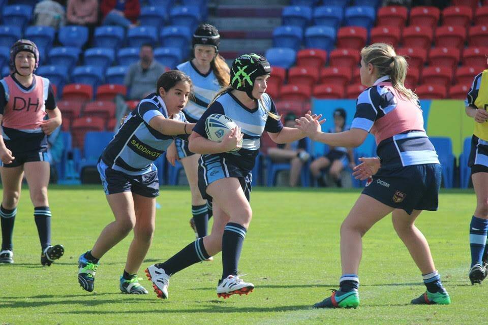 GIRL POWER: Girls from Tanilba Bay and Raymond Terrace in action in the final played at McDonald Jones Stadium last week. Picture: Supplied