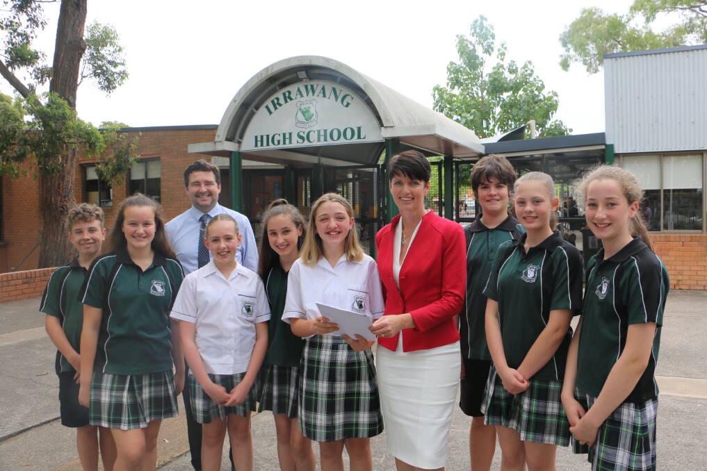 PETITION: Kate Washington accepts the petition from Year 7 Irrawang High School students in the company of principal Paul Baxter.