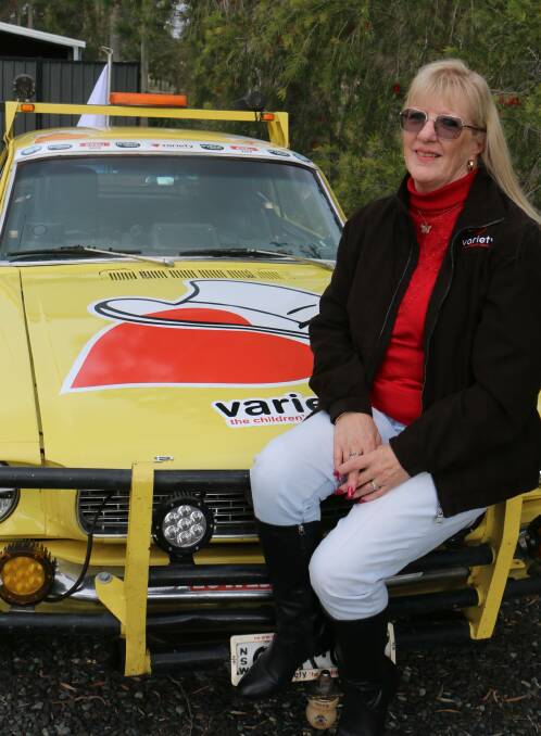 RECOGNISED: Medowie's Robin Henderson with her Variety Bash rally car, a 1966 Ford Mustang, which she has owned since 1988.