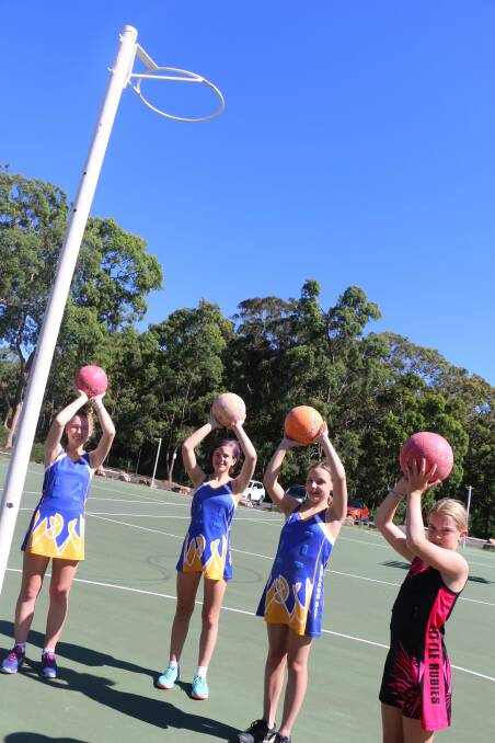 2021 GOAL: Nelson Bay Netball Association players, from left: Chelsea Loose, 14, Taylor Loose, 12, Anneliese Jones, 11, and Ellie Loose, 10.