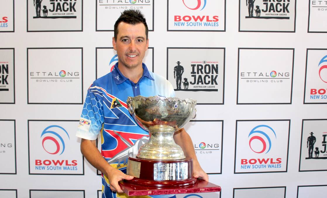 CHAMP: Raymond Terrace bowler Matt Baus with his NSW State singles trophy.