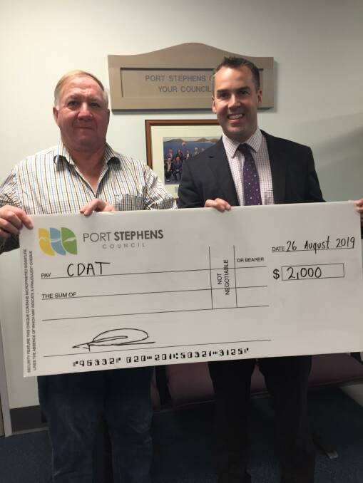PRESENTATION: A cheque for $2,000 was presented to Rob Hole from CDAT by Port Stephens mayor Ryan Palmer (Picture Supplied)