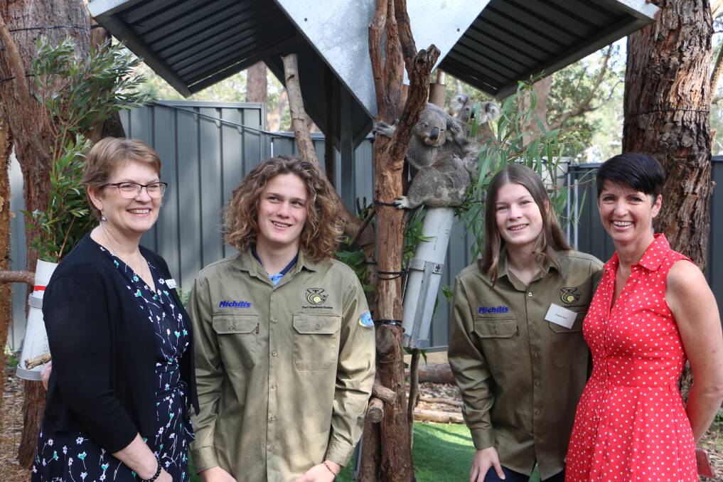 WORK EXPERIENCE: Tomaree High students Carter Mullins, 16, and Tatum Hunt, 14 with princial Sue Xenos and MP Kate Washington in one of the koala sanctuary enclosures with Eila and Patu.