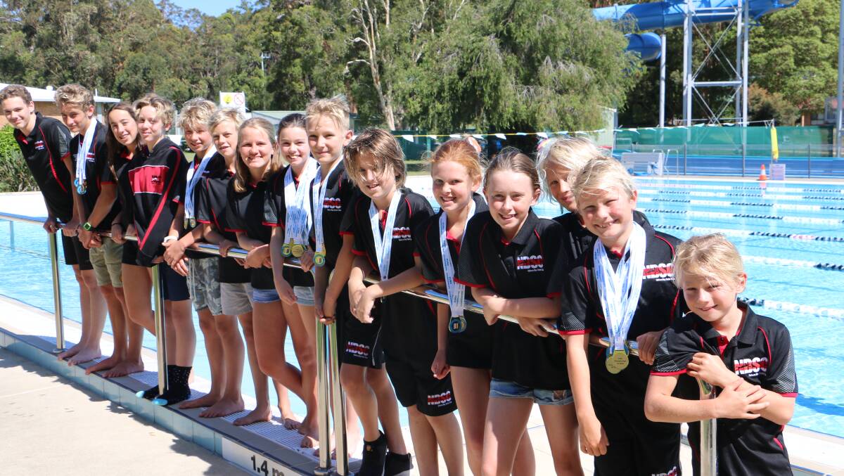 MEDALISTS: Tomaree Aquatic Club members show off their swim medals poolside.