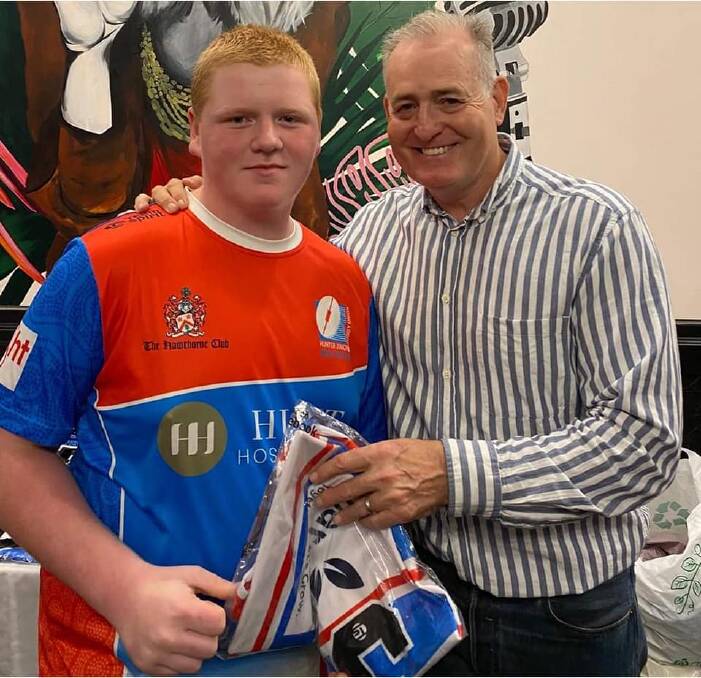 SELECTION: Connor Lowdell being presented with his Hunter Wildfires jumper from Wallaby legend David Campese. Picture: Supplied
