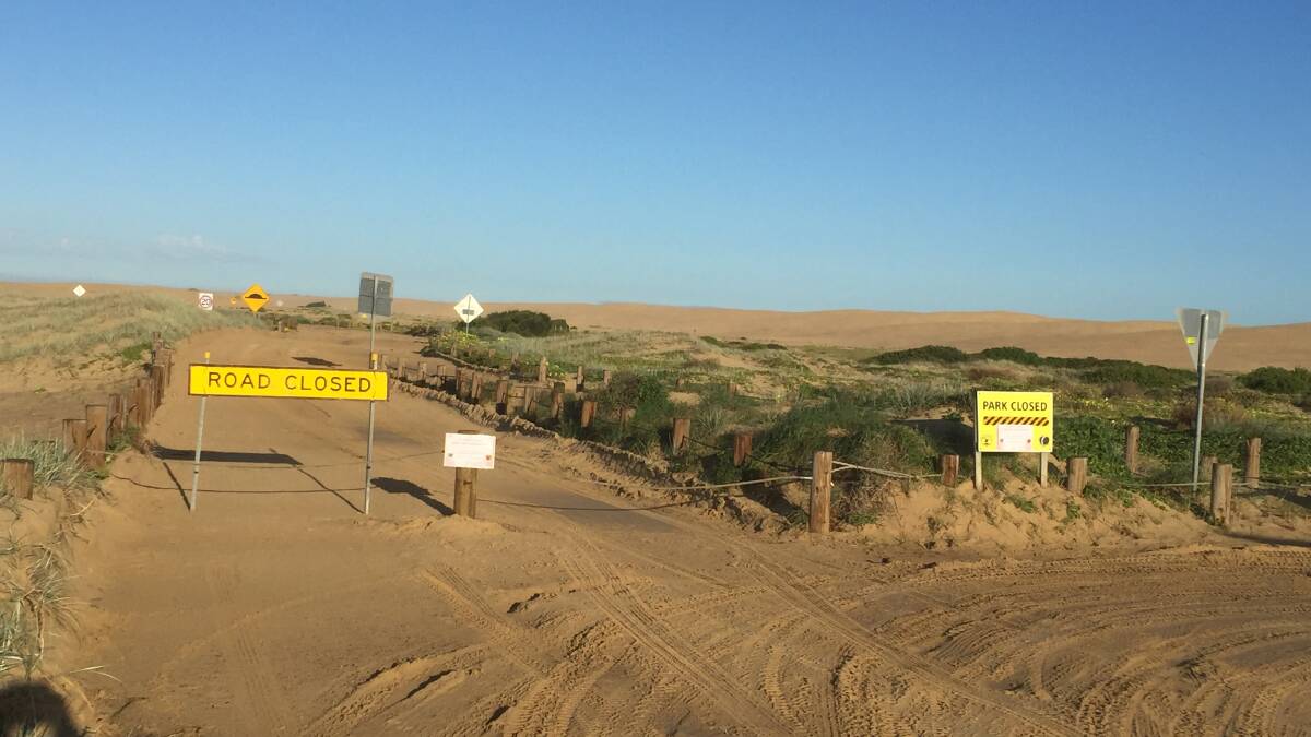 ROADBLOCK: The access road to Birubi Beach and Stockton sand dunes has been closed to all traffic.