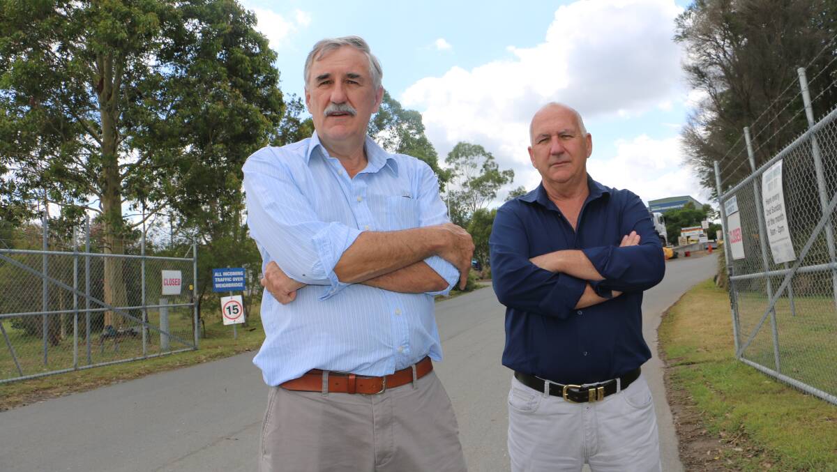 BEWILDERED: Port Stephens councillors Steve Tucker and Paul Le Mottee in front of the Newline Road waste management facility in 2018.