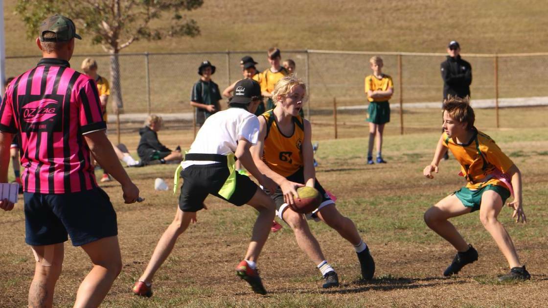 ACTION: The Oztag summer competition is for boys and girls.