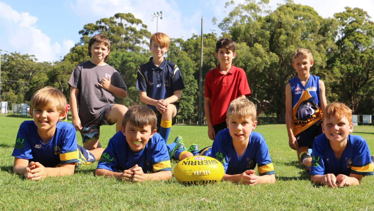 READY FOR ACTION: Members of the Nelson Bay junior AFL under 11s team prepare for training at Dick Burwell Oval.