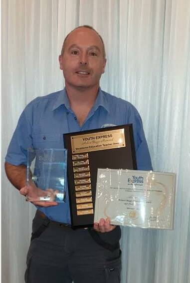 AWARDED: Tomaree High teacher Adrian Crew with his Robert Begg's Vocational Education and Training (VET) Teacher of the Year awards. Picture: Supplied