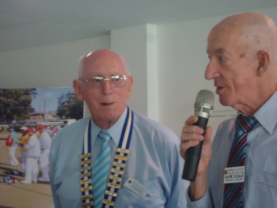 CHANGEOVER: Outgoing president Maurie Douglass welcomes incoming Ian Sloggett at the Probus Club's annual general meeting.