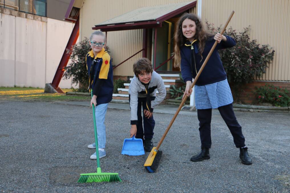 WORKING FOR THE SCOUTS: Raymond Terrace Scouts Ivy Morrison, aged 8, John Dent, 10, and his sister Jasmine Dent, 12, prepare for Job Week.