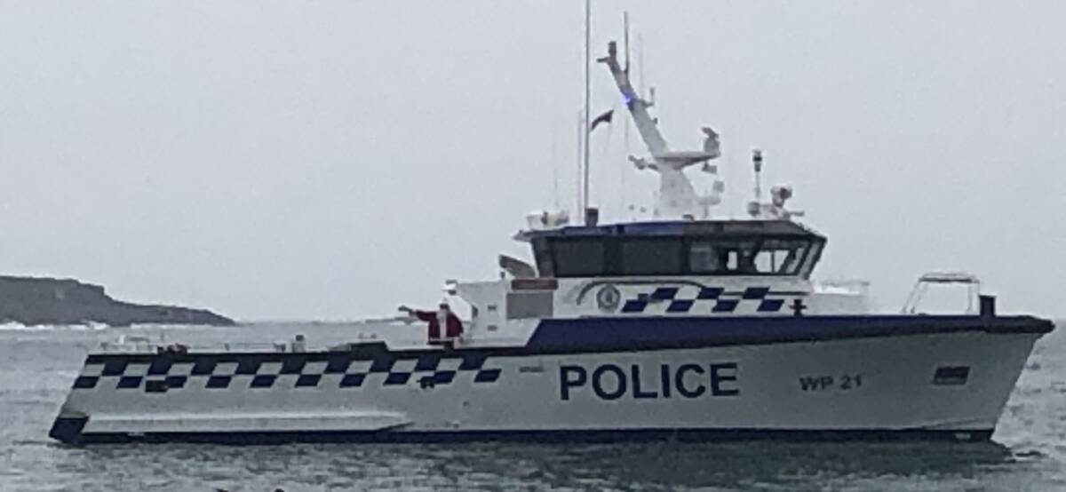 SANTA BY BOAT: Santa on board police launch Intrepid, which will be delivering lollies to children around Port Stephens on Christmas Even between 12pm-2.30pm.
