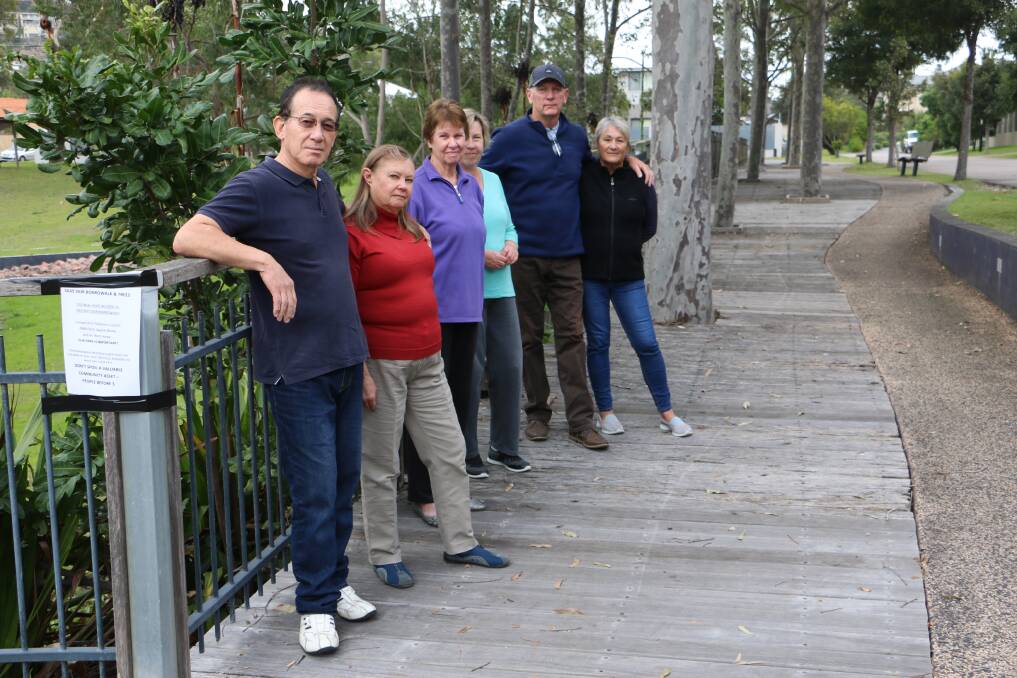 RESIDENTS RALLY: Primary Crescent residents Harry and Jenny Parker, Elizabeth and Jane Edgar and Steve and Lina Wasson standing on the boardwalk council has deemed as having "deteriorated beyond repair".