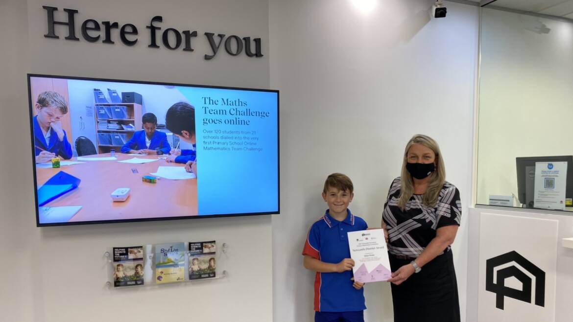 WINNER: Medowie's Ethan Piesto receives his award from Raymond Terrace acting branch manager at Newcastle Permanent, Katherine Griffiths. Pictures: Supplied