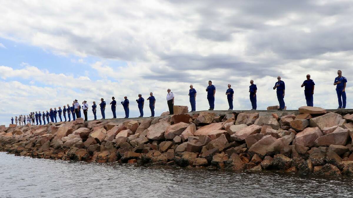 HONOURED: The guard of honour at Nelson Bay breakwall for Marine Rescue member Barney Pinney, who died in December. Picture: Supplied
