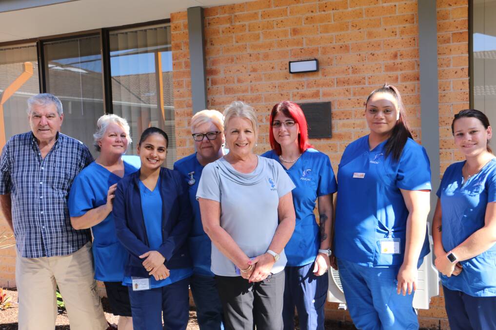 STAFF: Harbrouside Haven board chairman Gerry Mohan with unit manager Kerrie Williams and staff in the nursing home courtyard.