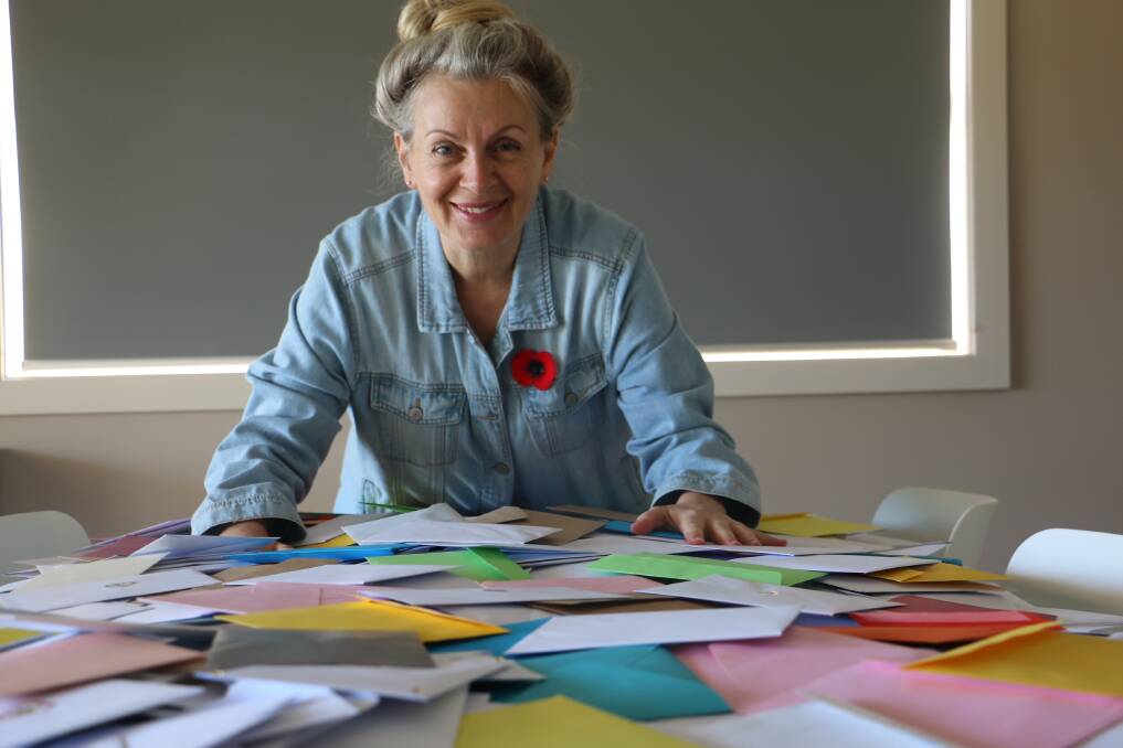 CARDS GALORE: Corlette's November Sheehan with some of the thousands of cards she hopes to distribute this Mother's Day to people who are elderly, lonely or anxious.