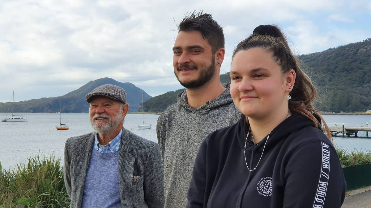 PHOTO COLLECTION: Jordyn and Matthew Alley (front) were presented with honorary lifetime Tomaree Museum Association memberships by John Clarke at Shoal Bay. Picture: Supplied