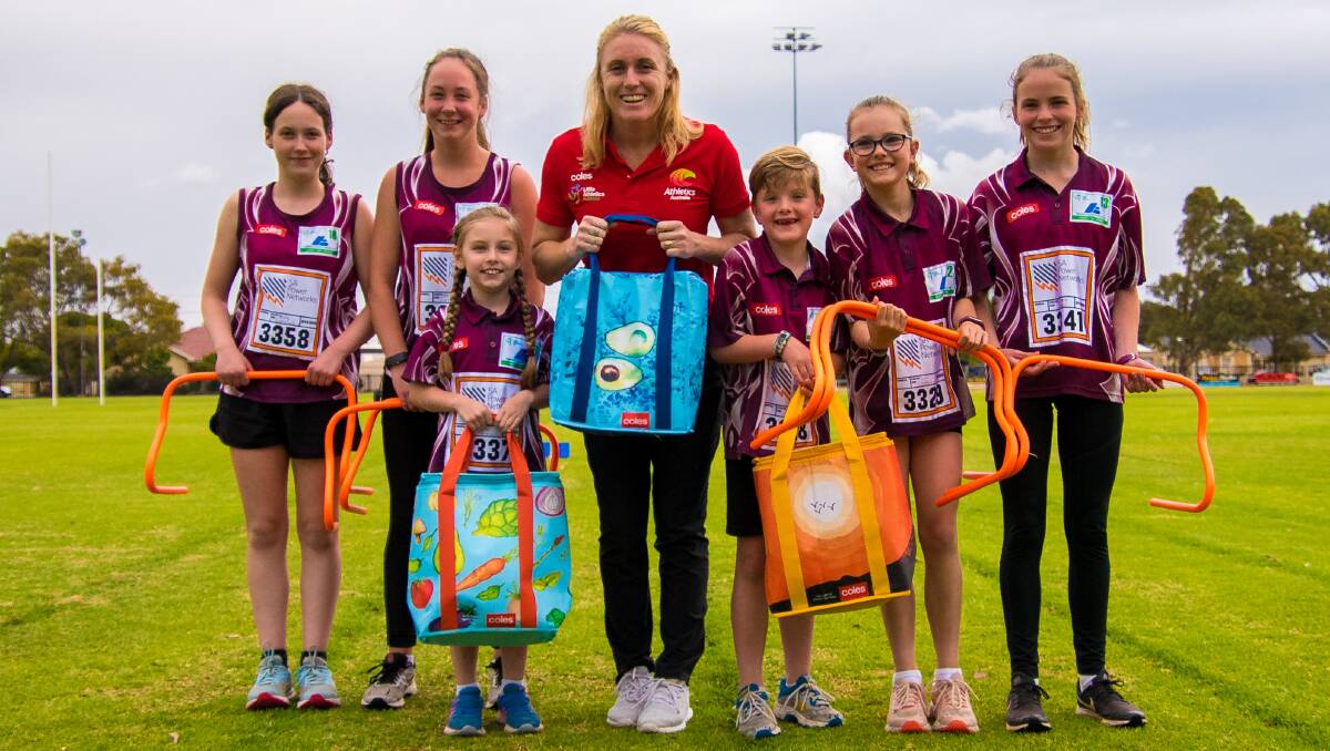 TEAM WORK: Sally Pearson and Little Athletes with the Coles community bags that funds new sports equipment. Picture: Supplied