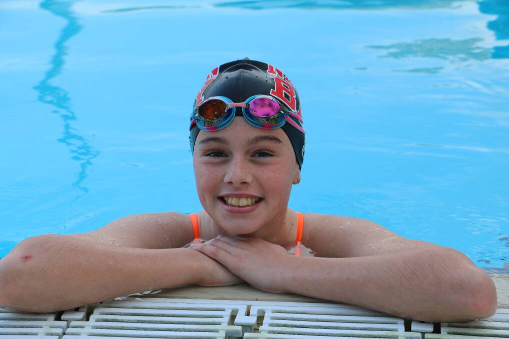 MEDAL WINNER: Nelson Bay's Ebony Nix, 12, with her silver and bronze medals won at the recent state swimming carnival