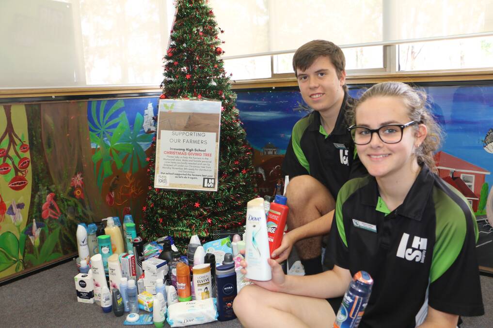 GIVING: Irrawang High School's recently elected captains Sierra Noffke and Nick Hopper, both aged 16, with the Christmas giving tree.