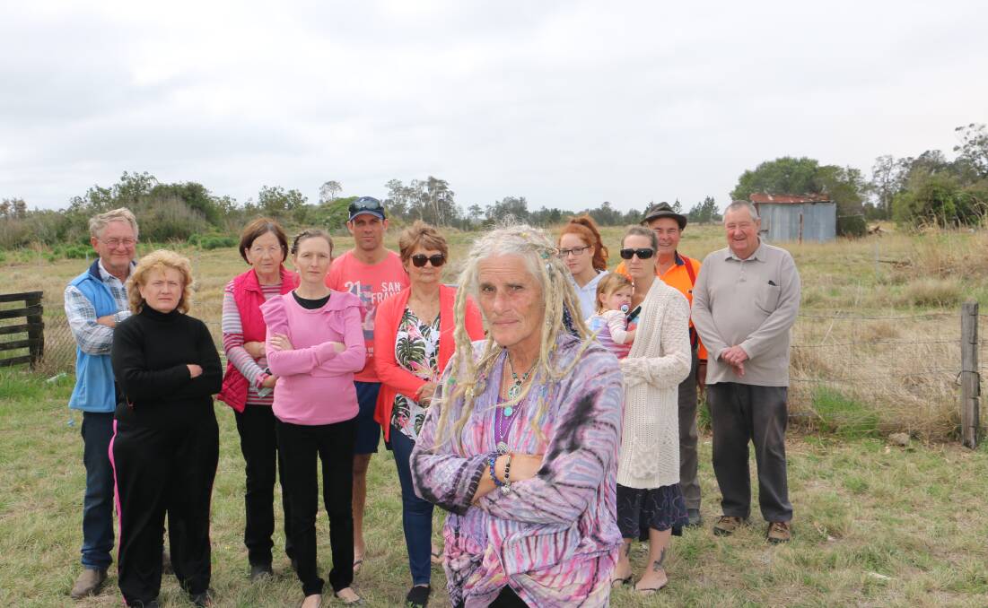 FRUSTRATED: Linden Drysdale with a group of Williamtown residents back in September 2018. There is opposition to the development application for landfill being proposed adjoining her Cabbage Tree Road property.