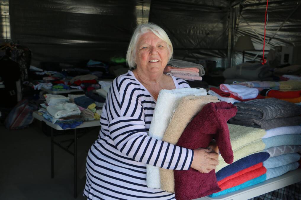 FOR SALE: Jackie Hallam with some of the items up for sale at Latitude One in Anna Bay on Saturday, July 4.