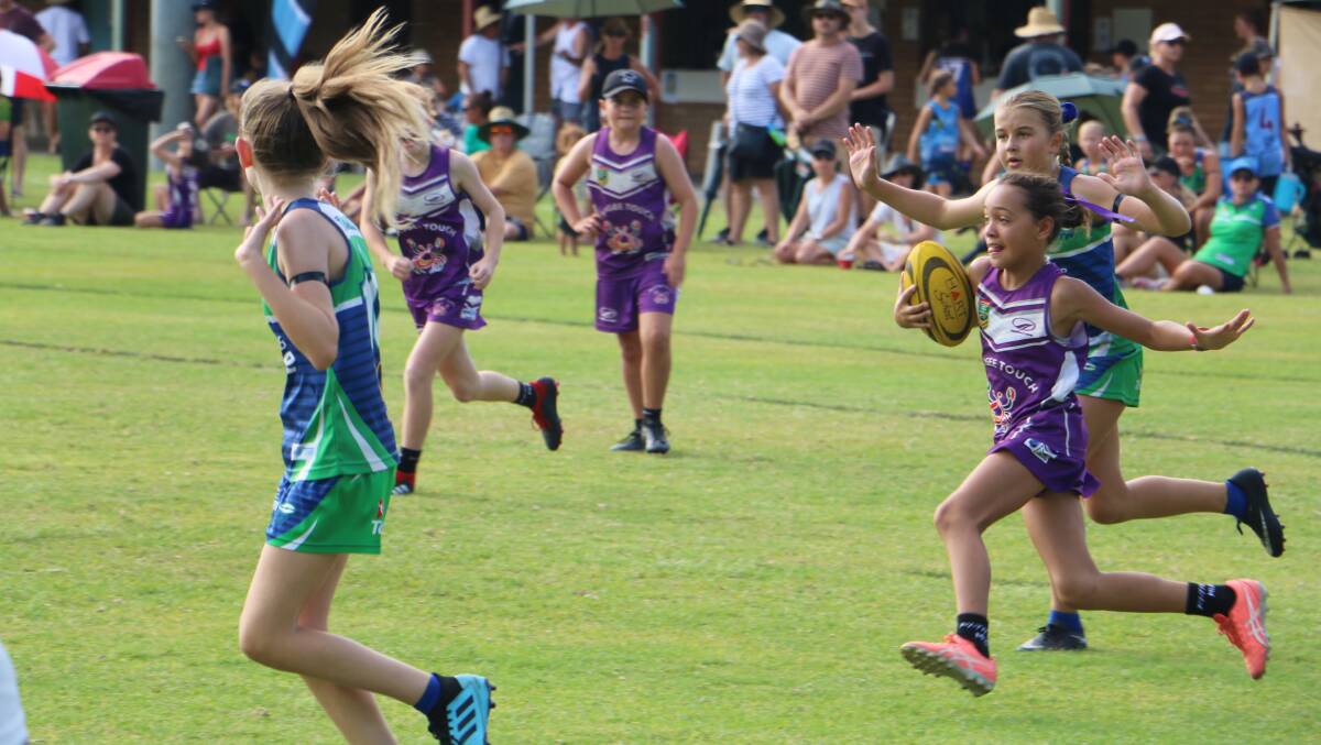 IN PLAY: Action form the 2019 Peter Wilson Memorial touch football tournament held at Tomaree. Nelson Bay is hoping to host the carnival again in February 2022.