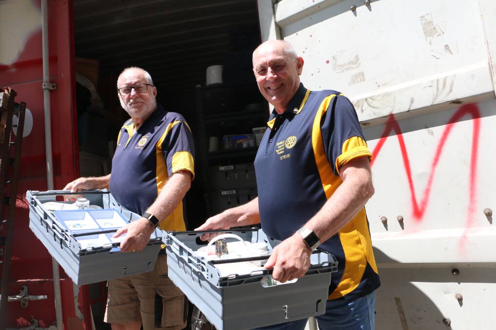 BIG HEARTED: John Chambers (left) with fellow Rotarian Steve Merritt with some of the items they donate to the needy in Raymond Terrace.