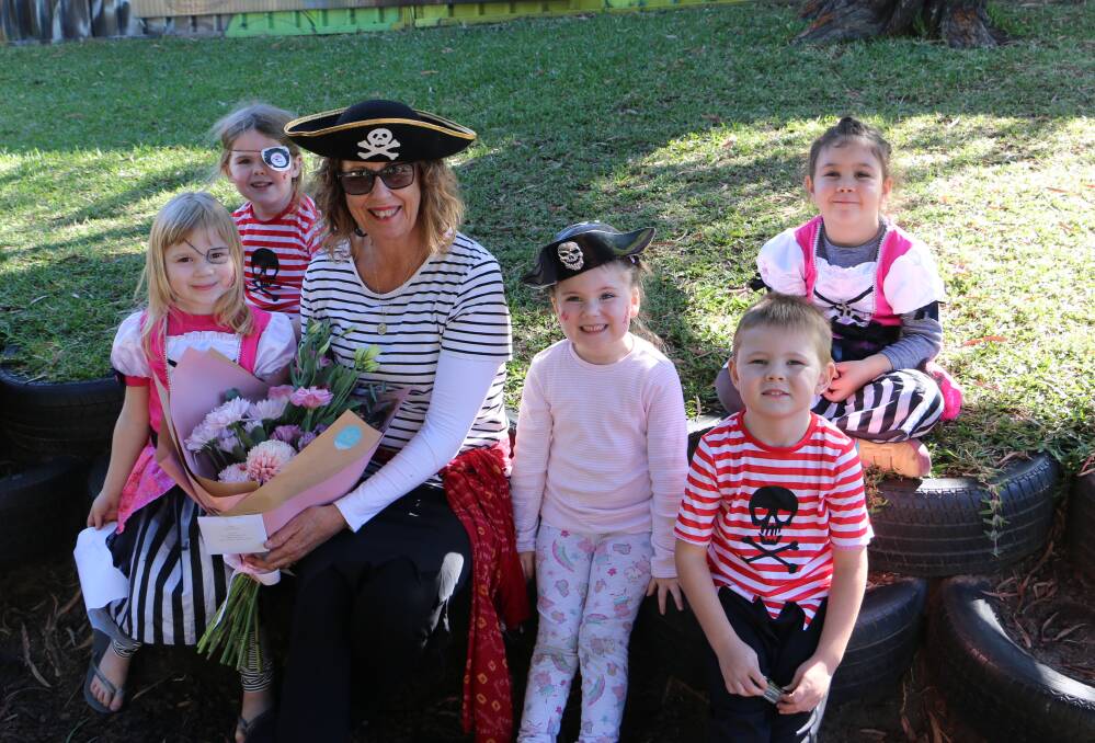 RETIREMENT: Lyn Coghlan with children from Angel Tots early childhood centre at Salamander Bay on her final day dressed in a pirate's outfit.