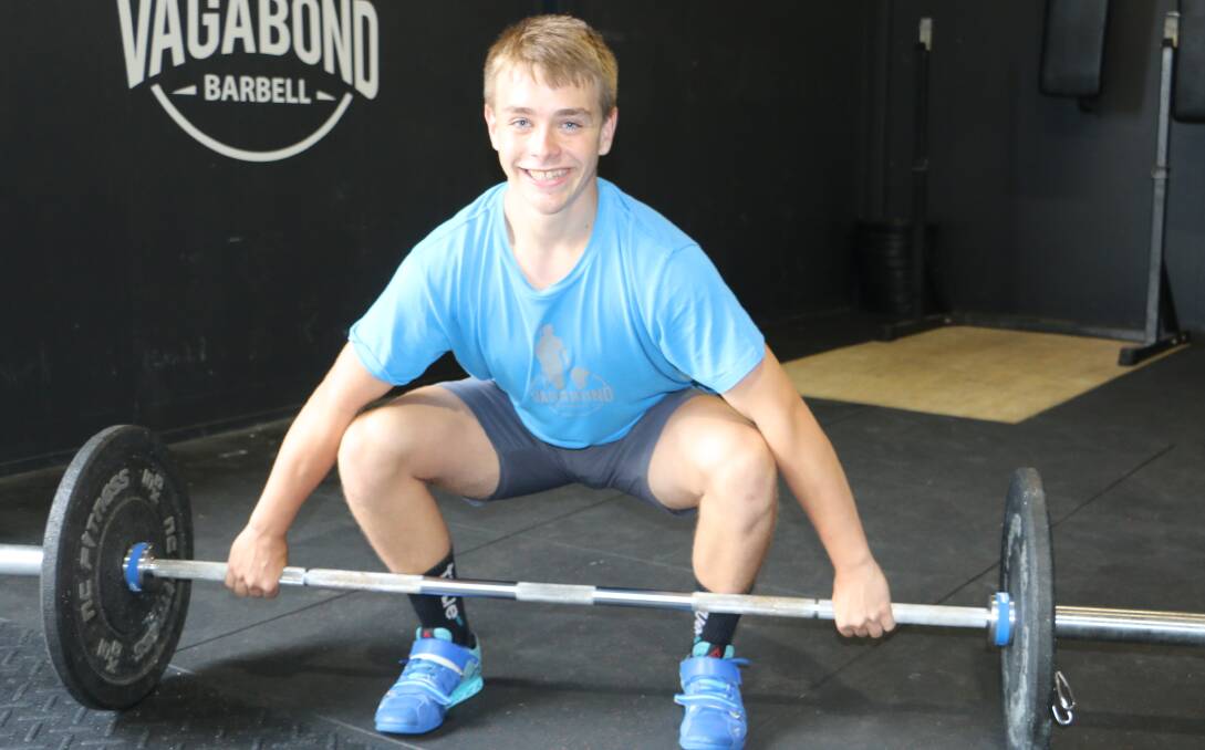 LIFT POWER: Fourteen-year-old Rhys Stewart in training at the Raymond Terrace Deck Crossfit under the guidance of Adam and Alana Edwards.