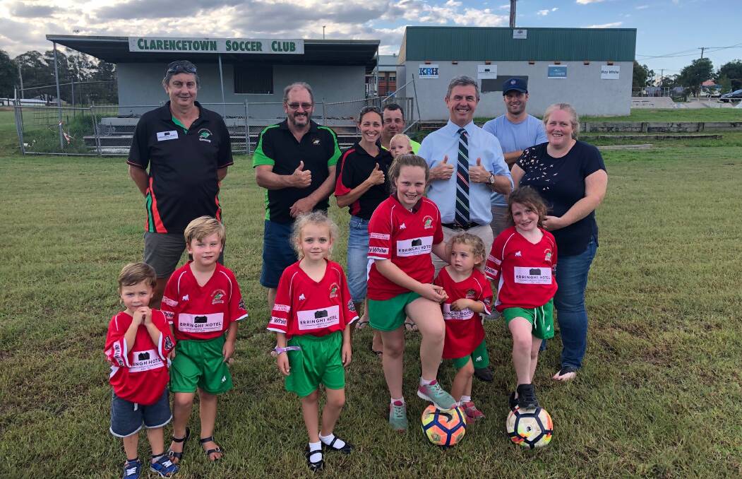 FUNDING: Players, coaches and officials from Clarance Town Football Club welcome the announcement by Federal Member David Lyne of a $4,000 grant.