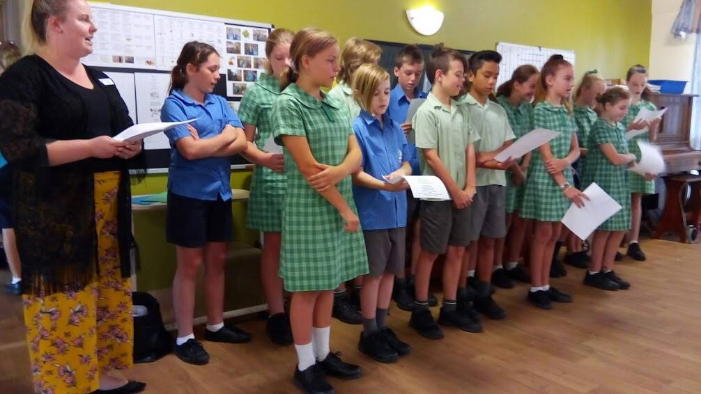 PERFORMANCE: Students from St Michael's entertained residents and handed out Easter gifts to the residents of four aged care facilities in Port Stephens.